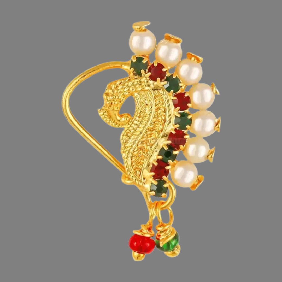 Traditional Gold Plated Tar Nose Ring Nathani Nath with Pearl CS. Traditional Wearing Gold Plated,Pearl With CZ,Tar Nose Ring (Tar)
Color:  Golden
Ethenic : Nath, Nathani , Tar, Nose ring
Style:  Pearls Studded
Material:  Alloy
Stone Type:  American Diamond
Length: 3.0 (in cm)
How to Wear - This is a clip on nath to put on left nostril of the nose. Just clip on the nose stud on left nostril and press the back side of nath nose ring and it will hook onto the nose.